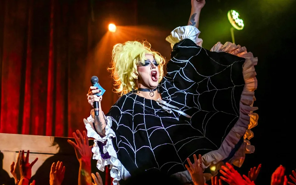 Madame Arthur singer wearing a black ruffled costume